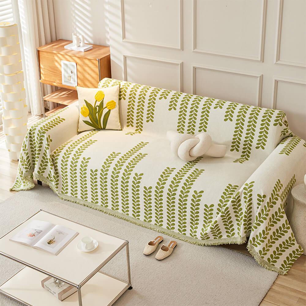 Copertura per divano con motivi a foglie e frange – eleganza e comfort 