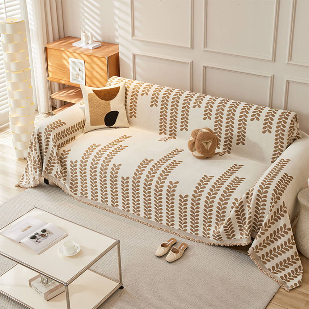Copertura per divano con motivi a foglie e frange – eleganza e comfort 